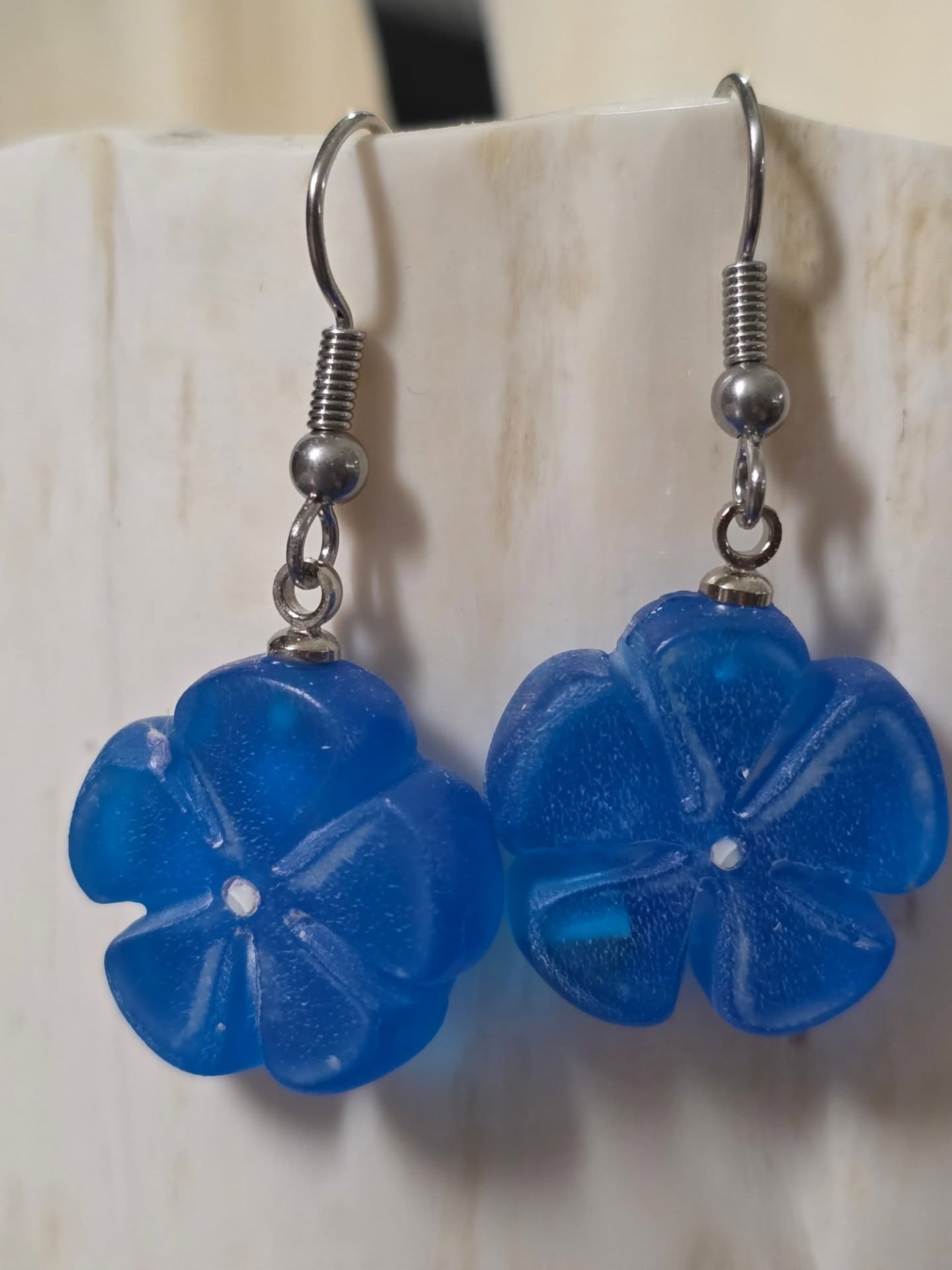 Forget-me-not blue epoxy and ivory earrings by Vince G